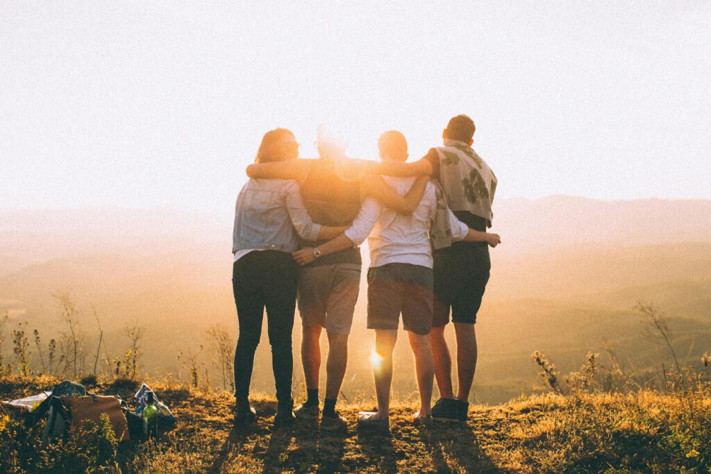 A group of friends embrace